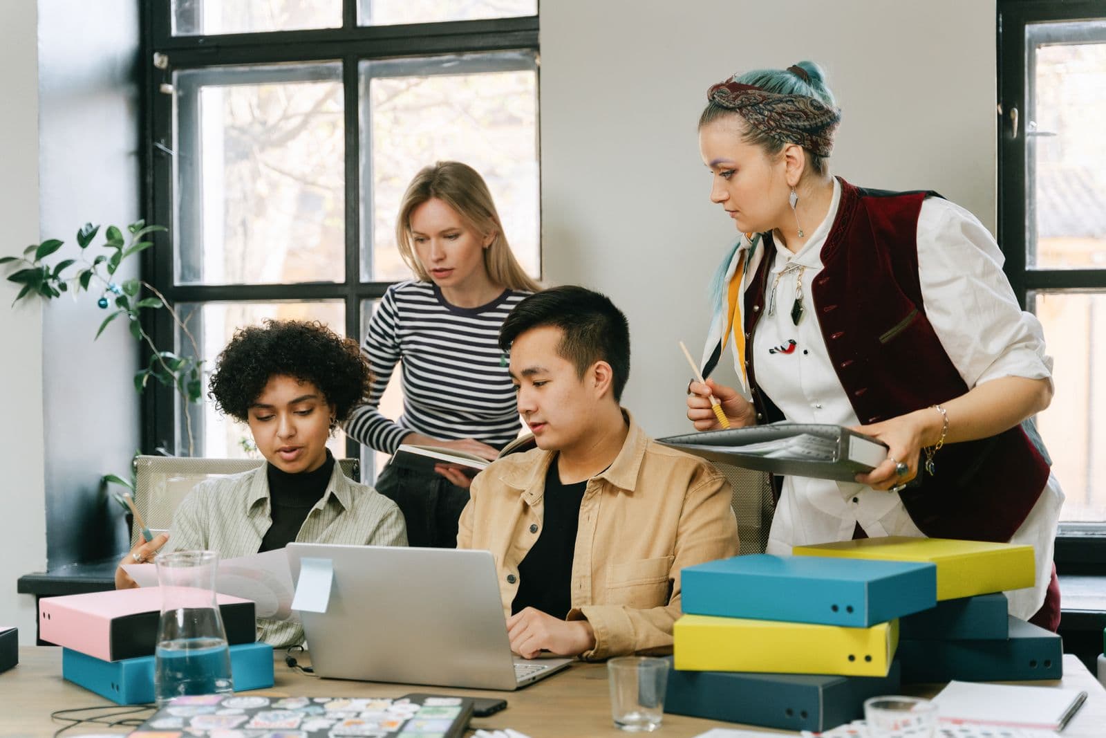 Event team reviewing files together on a laptop