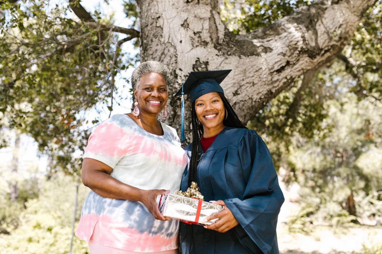 Graduate celebrating with her mother after the ceremony