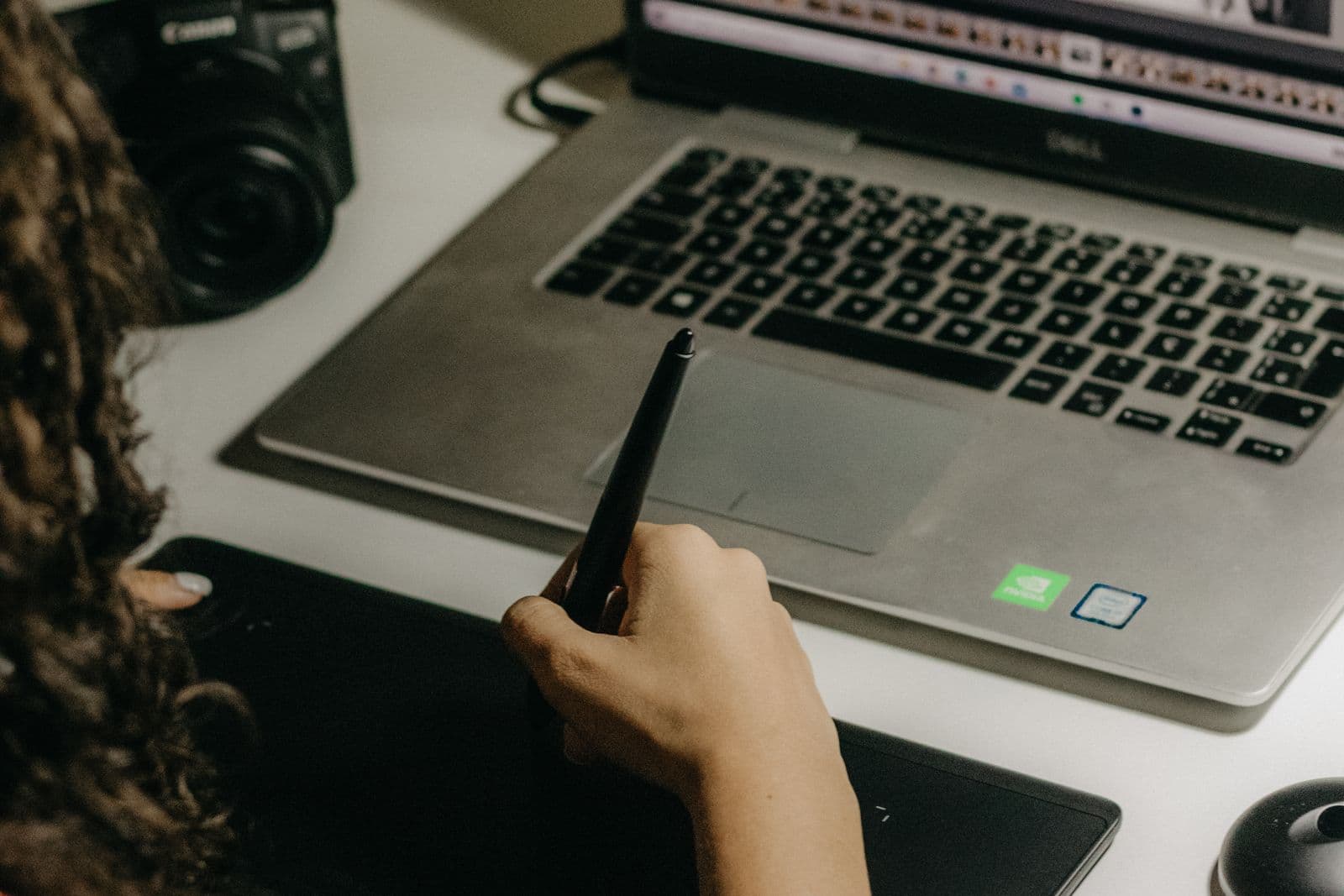Photographer editing a large set of images on a laptop