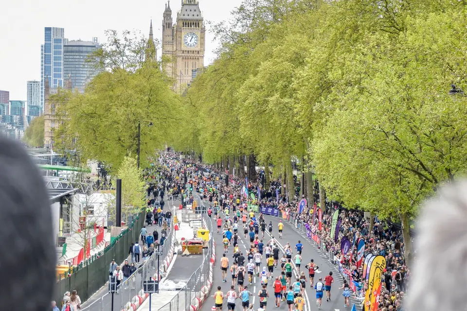 City marathon runners and spectators near Big Ben in London